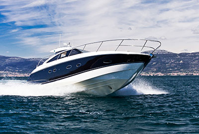 boat skimming across lake